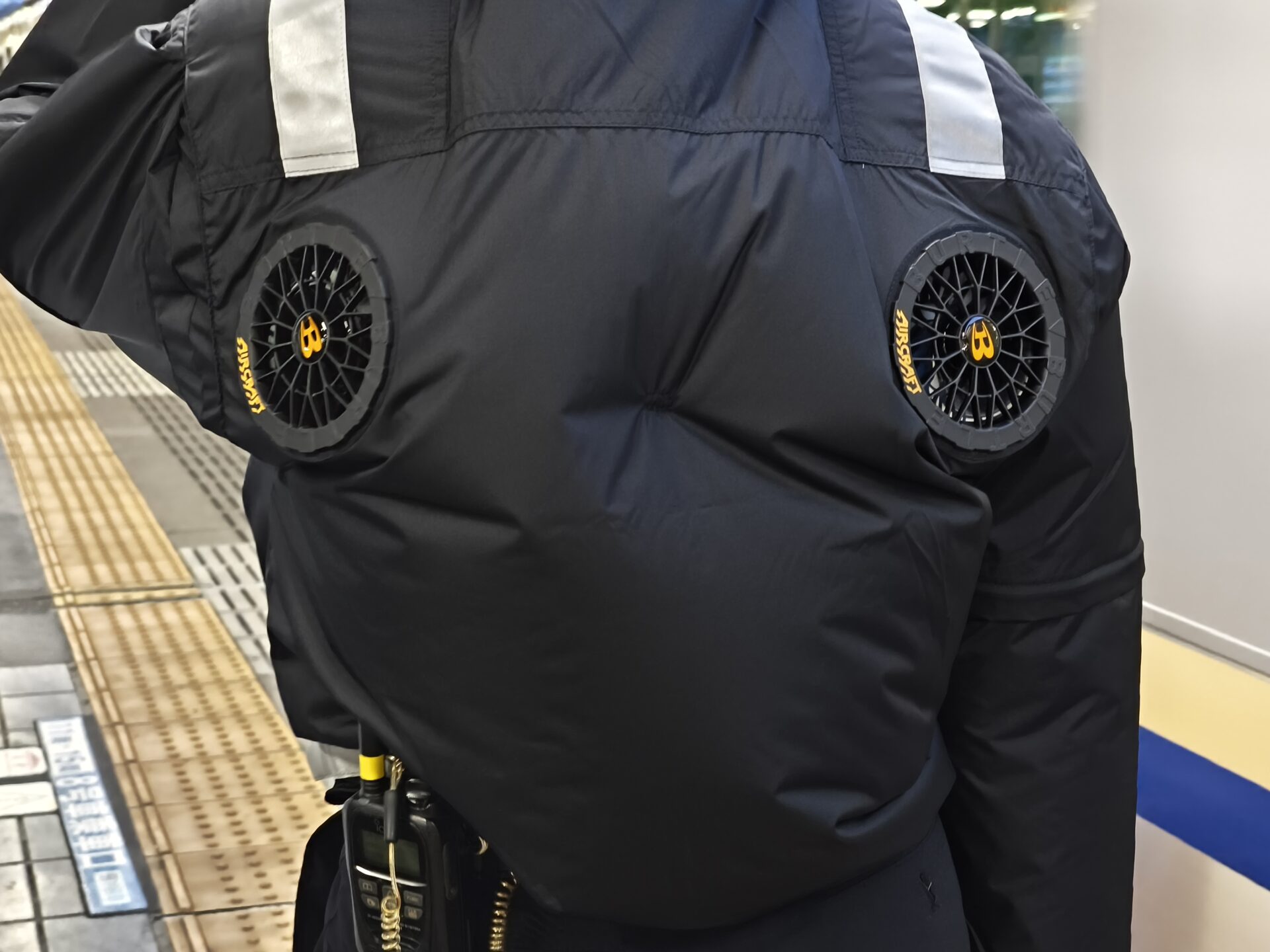 Fan-cooled work jacket worn by a JR East station staff member